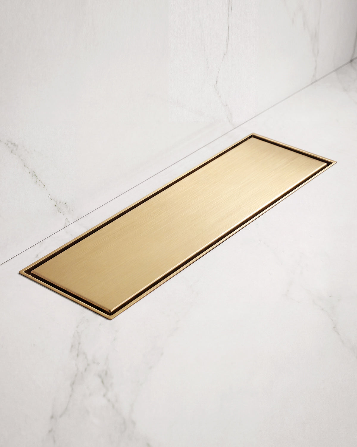 Brushed nickel bathroom accessories—a double towel bar, towel ring, soap dispenser, and soap dish—are displayed on white marble to stylishly complement the GRANDJOY Modern Single-Hole Bathroom Sink Faucet with Single Handle.