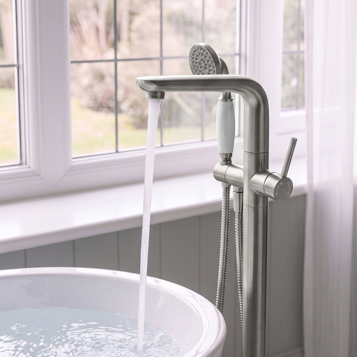 Floor-Mounted Bathtub Faucet with Hand Shower and Swivel Spout