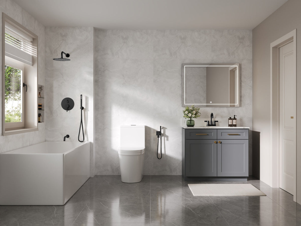 Bathroom with a wall-mounted rainfall shower, handheld spray, bathtub, and vanity